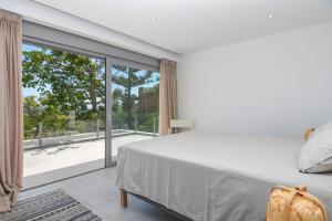 Posteľ alebo postele v izbe v ubytovaní Graham Holiday Rentals - Les Bassetes