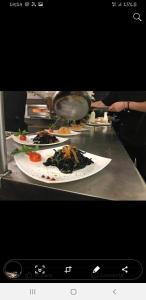 a counter with three plates of food on it at B&B La dolce siesta in Locogrande