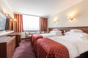 Posteľ alebo postele v izbe v ubytovaní Hotel Gołębiewski Białystok