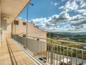 a balcony with a view of a building at Belvilla by OYO Villa in Santa Caterina Villarmosa in Santa Caterina Villarmosa