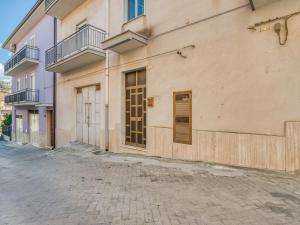 an empty street in front of a building at Belvilla by OYO Villa in Santa Caterina Villarmosa in Santa Caterina Villarmosa