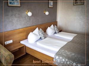 Postel nebo postele na pokoji v ubytování Hotel Kollerhof