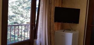 TV o dispositivi per l'intrattenimento presso Ruzan hotel