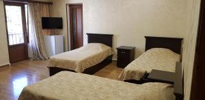 Letto o letti in una camera di Ruzan hotel