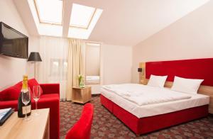 Telewizja i/lub zestaw kina domowego w obiekcie Cottonina Hotel & Mineral SPA Resort