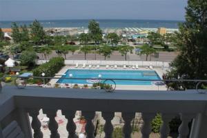 a view of a swimming pool from a balcony at Hotel Britannia in Cesenatico