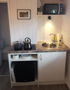 A kitchen or kitchenette at Forest Heath Shepherd's Huts