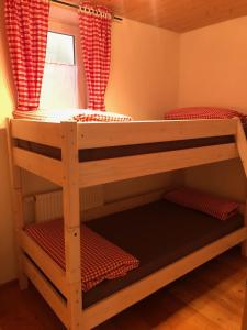 a bunk bed in a room with a window at Ostallgäu in Ruderatshofen