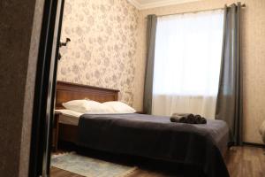 Postel nebo postele na pokoji v ubytování Bogdanov Yar Hotel