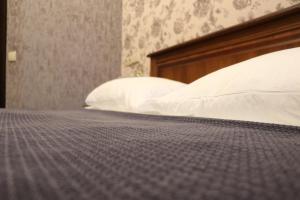 Postel nebo postele na pokoji v ubytování Bogdanov Yar Hotel