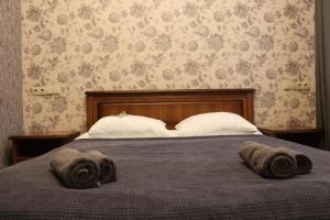 Postel nebo postele na pokoji v ubytování Bogdanov Yar Hotel