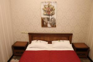 Postel nebo postele na pokoji v ubytování Bogdanov Yar Hotel