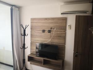 TV a/nebo společenská místnost v ubytování Praia Carneiros Flat Hotel