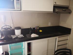 Kuchyň nebo kuchyňský kout v ubytování Praia Carneiros Flat Hotel