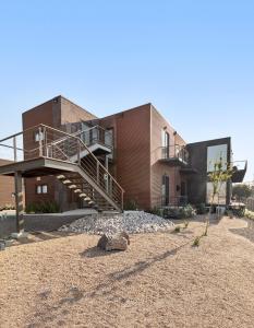 a house with a staircase on the side of it at Suite Loft Moderno Ubicación Inmejorable 104A in Querétaro
