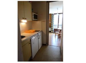 Residence Sagittaire - maeva Home tesisinde mutfak veya mini mutfak