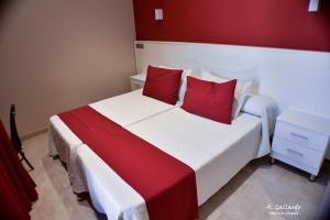 Postel nebo postele na pokoji v ubytování Hostal Playa Candor