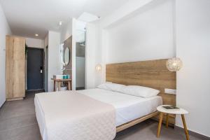 Posteľ alebo postele v izbe v ubytovaní Moscha Hotel