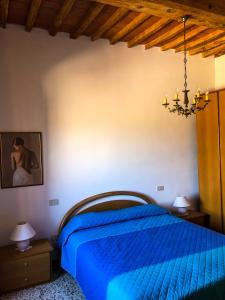 En eller flere senge i et værelse på Casa Vicolo