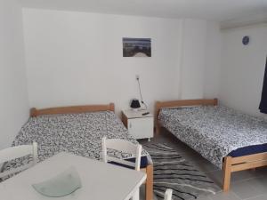 Postel nebo postele na pokoji v ubytování Smestaj Stanisavljevic