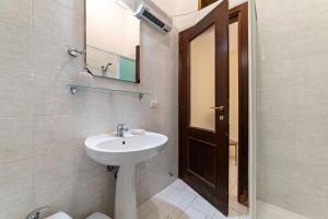 a bathroom with a sink and a mirror at Casa del Pescatore in Castellammare di Stabia +26 photos