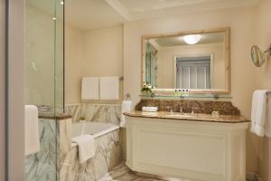 a bathroom with a tub, sink and mirror at InterContinental Dublin, an IHG Hotel in Dublin
