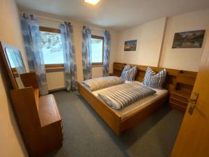 Posteľ alebo postele v izbe v ubytovaní Apartments Oberhollenzer