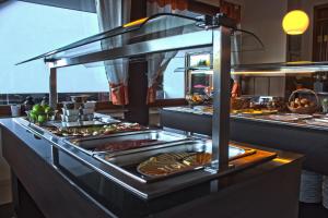 
a buffet table with plates of food on it at Hotel an der Nordschleife in Adenau
