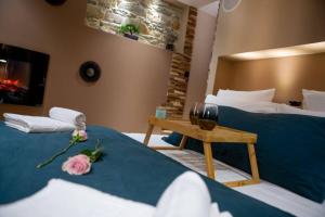 a hotel room with two beds and a fireplace at Nouveau - L'instant Passion - Love Room in Tourlaville
