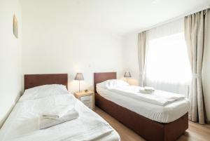 Uma cama ou camas num quarto em Hotel U Císaře
