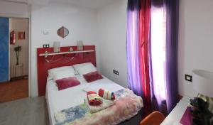 Łóżko lub łóżka w pokoju w obiekcie B&B Casa Alfareria 59