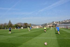 un grupo de personas jugando al fútbol en un campo en Don Angel - Adults Recommended, en Santa Susanna