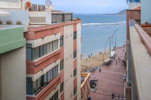 a view of the beach from a building at Atlantic Apartments in Las Palmas de Gran Canaria