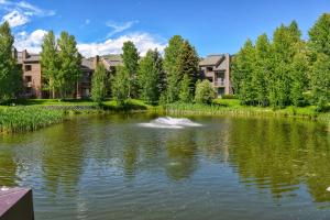 a pond with a duck in the middle at Western Dreams in Sun Valley