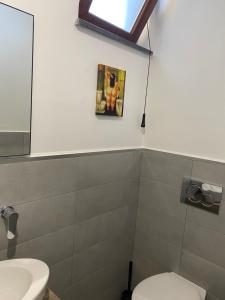 a bathroom with a toilet and a sink at B&B Villa Reginella in Agerola