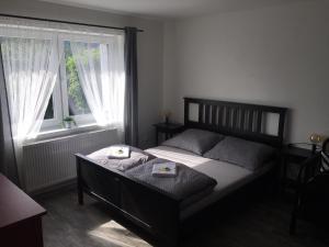 Postel nebo postele na pokoji v ubytování Apartmány LUKA - Hořejší Vrchlabí