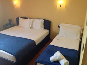 Postel nebo postele na pokoji v ubytování SIRIOHotel