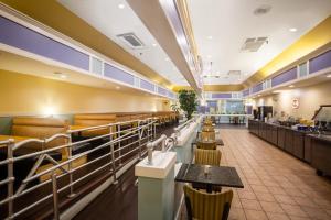 A restaurant or other place to eat at Super 8 by Wyndham Mobile I-65