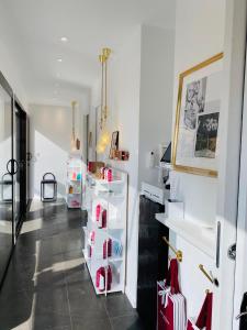 a room with a white refrigerator with its doors open at Hotel Centre Nautique in Bonifacio