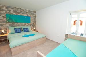 Postel nebo postele na pokoji v ubytování Old Town Rooms Piran