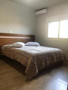 Una cama o camas en una habitación de Apto Derrubas Gramado