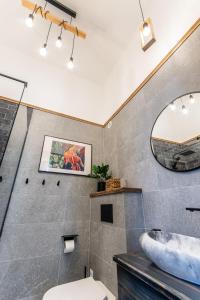 a bathroom with a sink and a mirror at Zur Linde in Sibiu