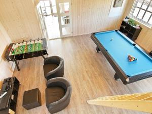 een woonkamer met een pooltafel bij 14 person holiday home in Odder in Odder