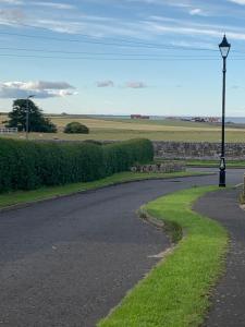 a street light on the side of a road at Brada View Bamburgh in Bamburgh