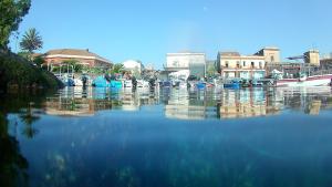 a group of boats docked in a body of water at Le case di Carlotta & Giorgia in Pozzillo