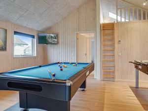 a billiard room with a blue pool table at 10 person holiday home in Hasselberg in Kappeln