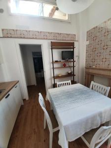 a kitchen with a table and chairs in a room at C'era una VOLTA...a STELLA in San Vito dei Normanni