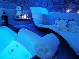 a room with two beds with blue lights at Mastrangelo Suite & Spa in Palermo