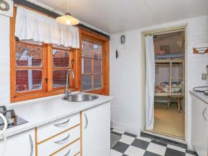 a kitchen with a sink and a window at 4 person holiday home in Ærøskøbing-By Traum in Ærøskøbing