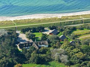 an aerial view of a house next to the ocean at Holiday Home Dyssestræde in Dannemare